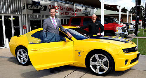 Dick Smith spokesperson Gray Bright (left) and Performax’s Kevin Thoroughgood with the special edition Transformers Camaro that was won by a Brisbane man in the Dick Smith competition. Dick Smith spokesperson Gray Bright (left) and Performax’s Kevin Thoroughgood with the special edition Transformers Camaro that was won by a Brisbane man in the Dick Smith competition.